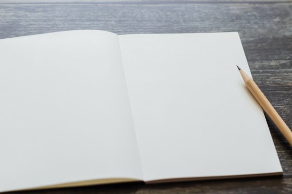 White blank journal for writing your story and gratitude message with natural pencil